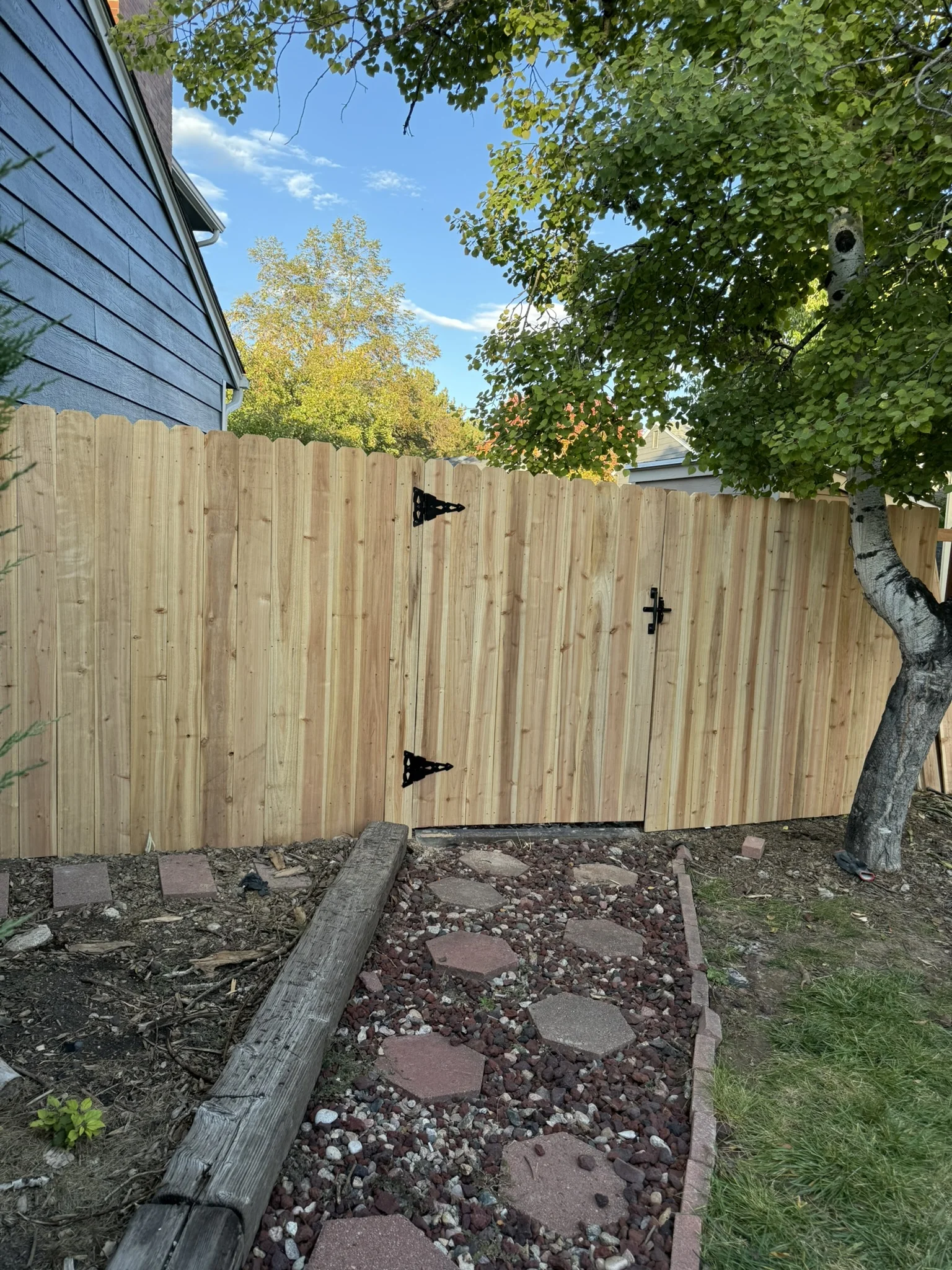 Freshly installed cedar privacy fence